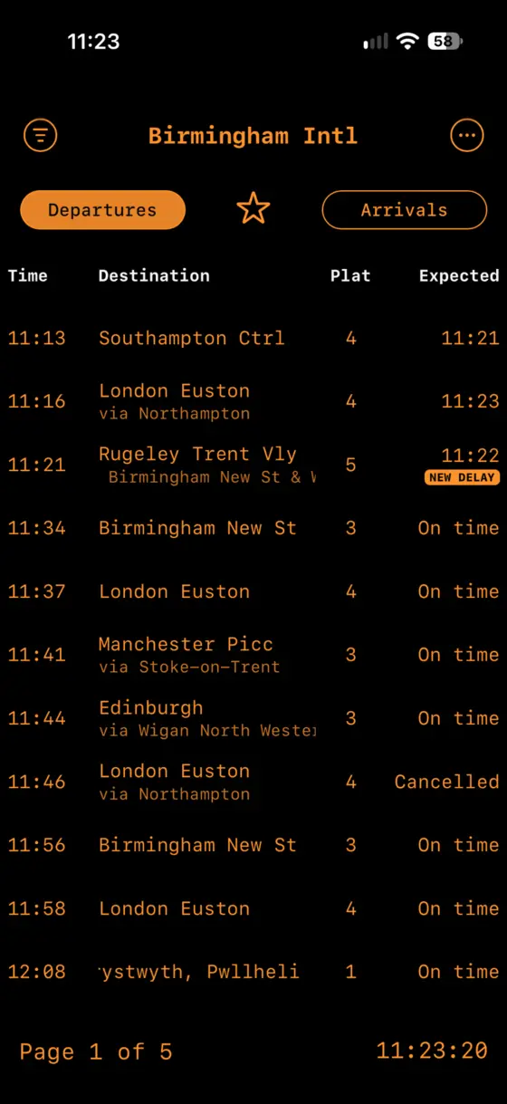 Birmingham International departures board showing a NEW DELAY recent-change badge